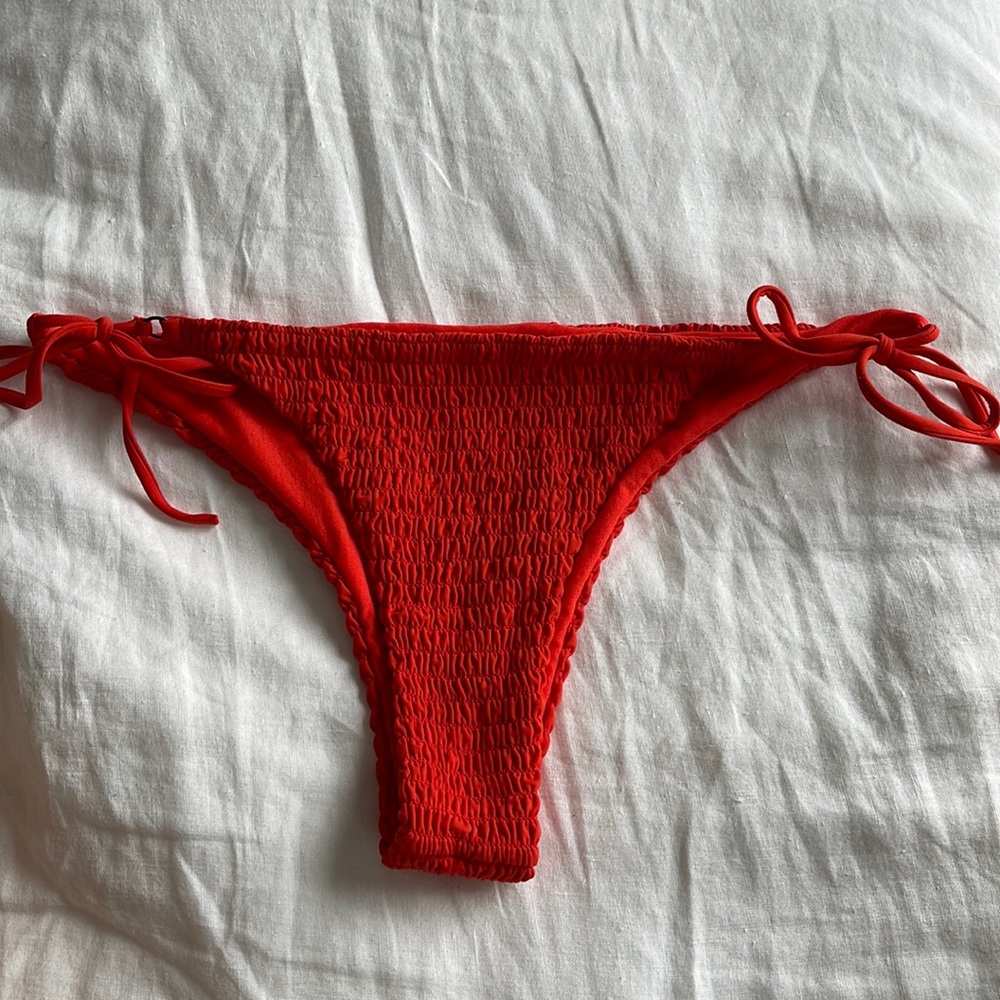 Red ruched bikini bottoms with adjustable side tie